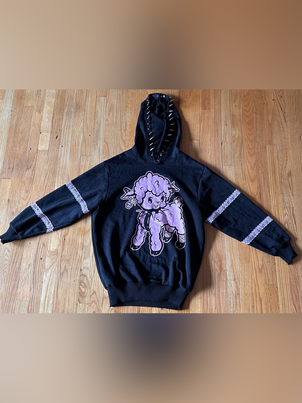 Dolls Kill black hoodie with metal spiked hood, pink lamb graphic design
